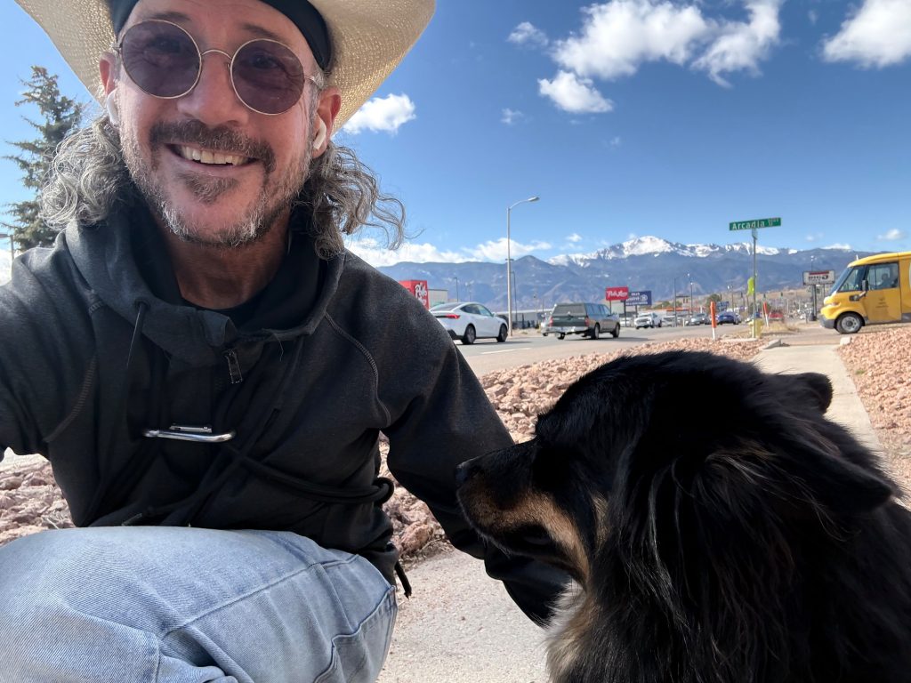 Richard outdoors with his dog